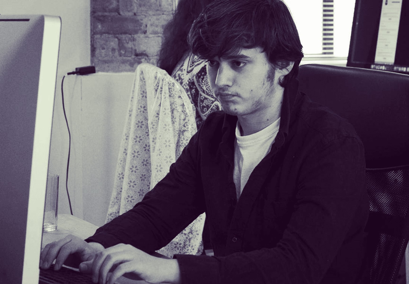 Nathan working at his desk at Spicerack